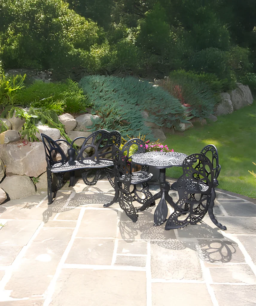 FlowerHouse Deluxe Butterfly Garden Set in white featuring a table, two chairs, and a bench with a classic wrought iron-inspired design